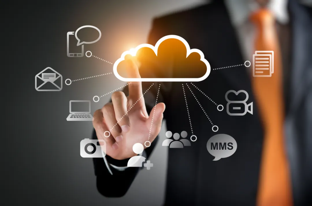 Businessman touching a cloud icon connected to email, messaging and file icons