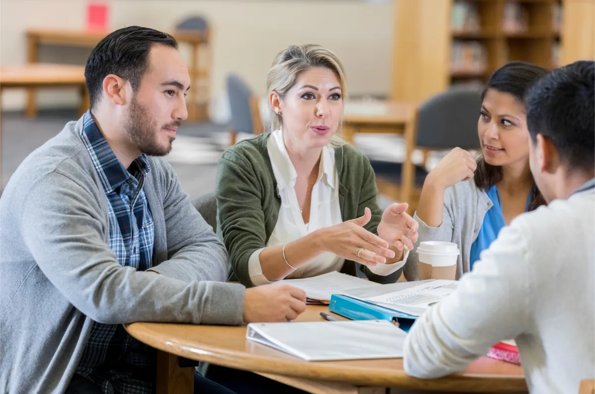 Teachers in a meeting around a table
